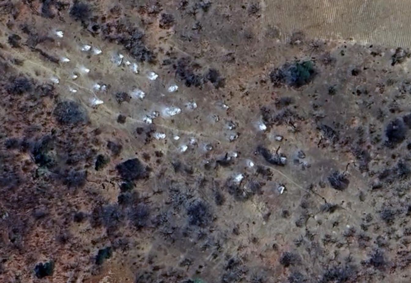 Aerial view of the Chunya project landscape, with exposed rock and vegetation